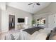 Main bedroom showcases vaulted ceilings, modern decor, neutral color palette, ensuite, and walk-in closet at 373 Shady Oak Loop, Davenport, FL 33896