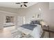 Bright main bedroom with exterior access, soft lighting, and a cozy seating area at 373 Shady Oak Loop, Davenport, FL 33896