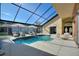 Sparkling swimming pool with a screened enclosure and lots of space to lounge at 373 Shady Oak Loop, Davenport, FL 33896