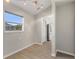 Bright room featuring a window, overhead lighting, and doorway leading into another room at 373 Shady Oak Loop, Davenport, FL 33896