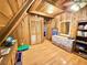 Cozy wood-paneled bedroom featuring a unique sloped ceiling and vintage dresser at 4075 Packard Ave, St Cloud, FL 34772