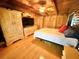 Bright bedroom featuring wood paneled walls and matching furniture at 4075 Packard Ave, St Cloud, FL 34772