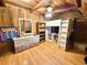 Charming bedroom featuring a custom-built loft bed and wood-paneled walls at 4075 Packard Ave, St Cloud, FL 34772