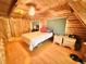 Cozy bedroom with a sloped ceiling and wood-paneled walls and ceiling at 4075 Packard Ave, St Cloud, FL 34772