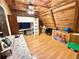 Quaint bedroom featuring a loft bed, wood-paneled walls, and sloped ceilings at 4075 Packard Ave, St Cloud, FL 34772