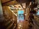 View of stairs leading to dining area featuring beamed ceilings and access to the kitchen at 4075 Packard Ave, St Cloud, FL 34772
