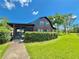 Charming two-story home with a screened in porch and well-manicured front yard at 4075 Packard Ave, St Cloud, FL 34772