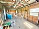 Spacious unfinished interior featuring exposed wood framing and natural light from the window at 4075 Packard Ave, St Cloud, FL 34772