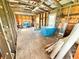 Bright unfinished interior with exposed framing, featuring a doorway and ample space at 4075 Packard Ave, St Cloud, FL 34772