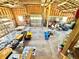 Spacious interior featuring exposed wooden beams, overhead lighting, large storage area, and lots of natural light at 4075 Packard Ave, St Cloud, FL 34772