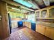 Well-lit kitchen with wooden cabinets, granite countertops and modern appliances at 4075 Packard Ave, St Cloud, FL 34772