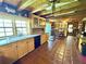 Kitchen showcases wood cabinets, granite countertops, and a view of the surrounding landscape at 4075 Packard Ave, St Cloud, FL 34772