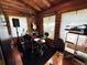 A cozy living space with a music setup and natural light from the windows at 4075 Packard Ave, St Cloud, FL 34772