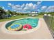 Clear blue pool with floats, perfect for relaxation and recreation in the backyard at 4075 Packard Ave, St Cloud, FL 34772