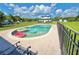 A beautiful in-ground pool with pool floats and a lovely rural view at 4075 Packard Ave, St Cloud, FL 34772