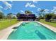 Backyard pool with floats on a sunny day with a large yard at 4075 Packard Ave, St Cloud, FL 34772