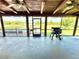 Covered back porch with a grill overlooking a lovely outdoor space at 4075 Packard Ave, St Cloud, FL 34772
