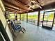 Spacious back porch with ceiling fans overlooking pool area at 4075 Packard Ave, St Cloud, FL 34772
