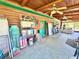Covered back porch with outdoor storage and seating at 4075 Packard Ave, St Cloud, FL 34772