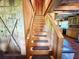 Wooden staircase with carpeted steps leading to the main living area at 4075 Packard Ave, St Cloud, FL 34772