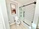 Bathroom featuring tiled tub/shower, modern fixtures, and neutral color palette at 4125 Packard Ave, St Cloud, FL 34772