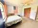 Comfortable bedroom with a ceiling fan, closet, and an American flag accent at 4125 Packard Ave, St Cloud, FL 34772