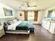Primary bedroom with barn door accents and shiplap wall at 4125 Packard Ave, St Cloud, FL 34772