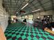 This large garage has checkerboard flooring and ample space for all of your hobbies and recreational equipment at 4125 Packard Ave, St Cloud, FL 34772