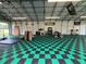 Checkerboard flooring brings style and sophistication to this large workshop and storage area at 4125 Packard Ave, St Cloud, FL 34772