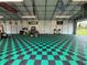 The checkered floors of this garage provide an attractive, clean space to work on projects and store equipment at 4125 Packard Ave, St Cloud, FL 34772