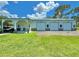 Well-maintained garage featuring multiple doors and a covered parking area, offering ample storage and convenience at 4125 Packard Ave, St Cloud, FL 34772