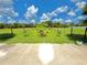 Beautiful backyard area featuring a fenced garden with various plants and a small potted tree on a sunny day at 4125 Packard Ave, St Cloud, FL 34772