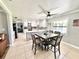 Open kitchen and dining area with a large island and modern appliances at 4125 Packard Ave, St Cloud, FL 34772