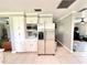 Modern kitchen with white cabinets and a stainless steel refrigerator at 4125 Packard Ave, St Cloud, FL 34772