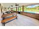 View of outdoor furniture under a covered patio overlooking the pool and backyard at 4125 Packard Ave, St Cloud, FL 34772