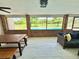 A lovely lanai with brick accents that overlooks a scenic pool and open field at 4125 Packard Ave, St Cloud, FL 34772