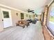 A beautiful lanai featuring lovely furniture, charming decor and an outdoor dining table at 4125 Packard Ave, St Cloud, FL 34772