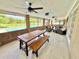 A relaxing lanai with plenty of seating, with an overlooking view of the pool and scenery at 4125 Packard Ave, St Cloud, FL 34772