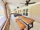Spacious lanai featuring outdoor furniture and charming decor creates a serene place to relax at 4125 Packard Ave, St Cloud, FL 34772