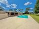 Enjoy the outdoors with this refreshing pool, complete with a spacious patio and privacy fence, nestled in green surroundings at 4125 Packard Ave, St Cloud, FL 34772