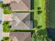 Aerial view of homes on a waterfront property, featuring serene lake and community at 418 Treviso Dr, Kissimmee, FL 34759