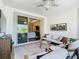 Relaxing screened porch features comfortable seating and views of both nature and the home's interior at 418 Treviso Dr, Kissimmee, FL 34759