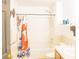 A well-maintained bathroom with a shower-tub combo, vanity, and classic finishes at 423 Midway Ave, Mascotte, FL 34753