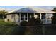 Charming single-story home featuring a metal roof and yard at 423 Midway Ave, Mascotte, FL 34753