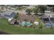 Aerial view of a home with a pool surrounded by a fence, lawn, and palm trees at 4830 Red Bay Dr, Orlando, FL 32829