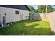 Spacious backyard with wooden fence and storage area at 4830 Red Bay Dr, Orlando, FL 32829