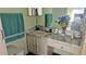 Bathroom featuring vanity with granite counters, fresh flowers, and stylish decor at 4830 Red Bay Dr, Orlando, FL 32829