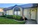 Charming home exterior featuring a well-manicured lawn and a welcoming front entrance at 4830 Red Bay Dr, Orlando, FL 32829