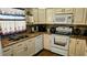 Well-lit kitchen featuring granite countertops and modern white appliances at 4830 Red Bay Dr, Orlando, FL 32829