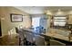 Open-concept kitchen featuring granite countertops, white cabinets, and an island with seating at 4830 Red Bay Dr, Orlando, FL 32829
